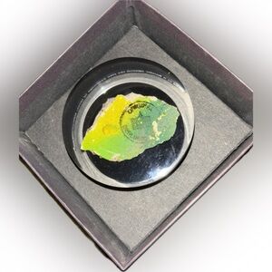 1989 Berlin Wall Remnant encased in Lucite-Paper weight. From Time Warner